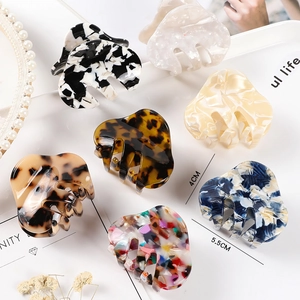 Set of 7 acetate hair claws in various patterns like tortoiseshell and marble, 4cm and 5.5cm