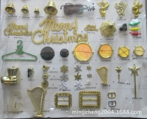 DIY Christmas accessories assortment including gold bells, stars and mini hat charms