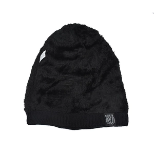 Close-up of black knit beanie featuring soft faux fur lining and animal woven label