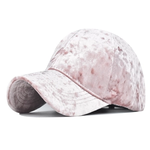 Detail showing the pink chenille baseball cap with a unique velvet texture and curved brim