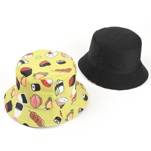 Detail view of cotton bucket hats with colorful sushi patterns and classic black design