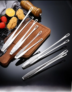 Set of five 304 stainless steel BBQ tongs with non-slip round hollow heads on wooden board