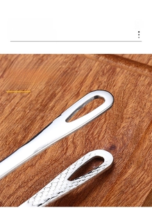 Macro detail of stainless steel kitchen tongs featuring hollow drainage design for frying