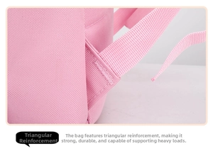 Close-up of pink school bag showing reinforced triangular stitching on shoulder straps