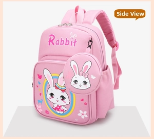 Side view of pink kids backpack with cute rabbit print and matching round coin purse