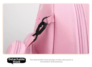 Detail of detachable black plastic hook and woven pink canvas texture on kids backpack
