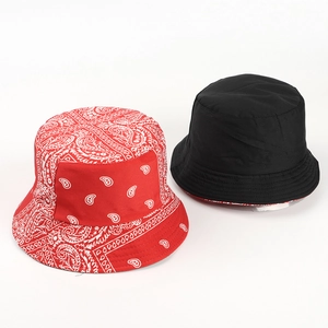 Close-up of reversible bucket hat showing red paisley print and solid black cotton canvas fabric