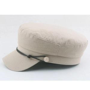 Beige flat top navy sailor hat with decorative black strap and silver metal button
