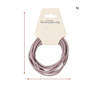 Detailed view of purple multi-strand elastic hair ties with 9cm display card dimensions