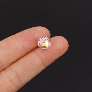 Minimalist round resin stud earring in pink with gold flakes and heart inlay