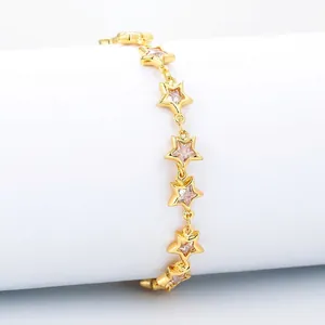 Golden star bracelet with sparkling zircon stones set against a clean white background