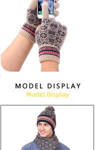 Detail of touchscreen winter gloves and knitted snowflake scarf set on model