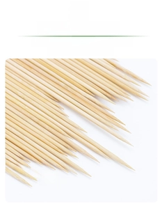 Close-up of bamboo BBQ skewers showing 45-degree sharpened tips for easy piercing