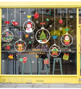 Storefront window display with Santa, reindeer, and Merry Christmas static stickers