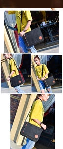 Outdoor street style shot showing black canvas messenger bag with adjustable shoulder strap