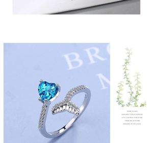Detailed view of S925 silver ring featuring blue heart stone and fishtail design
