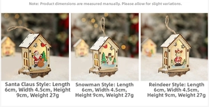 Close-up of small wooden LED Christmas houses featuring Santa, snowman, and reindeer