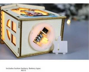 Detail view of the LED battery compartment for wooden Christmas house ornament