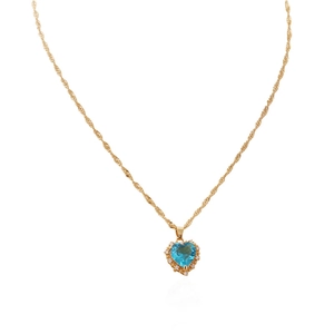 Close-up of gold twist chain necklace featuring a blue heart gemstone with diamond halo
