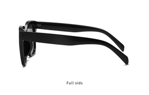 Side view of oversized black square sunglasses with glossy frames and dark grey lenses