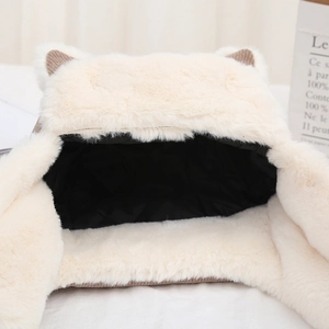 Detail of warm faux fur cat ear hat with black quilted lining and soft texture