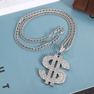 Macro view of silver hip hop necklace with iced-out dollar sign pendant and rhinestones