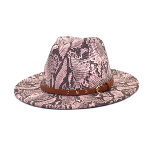 Pink and black snakeskin fedora hat with wide brim and studded leather band