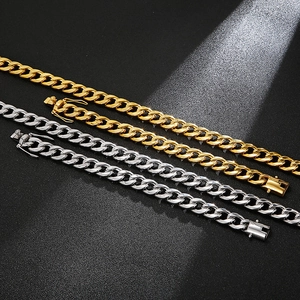 Close-up of gold and silver polished Cuban link bracelets with heavy metal texture