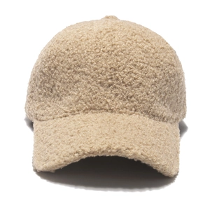 Detailed texture of warm beige faux lamb wool baseball cap with soft plush finish