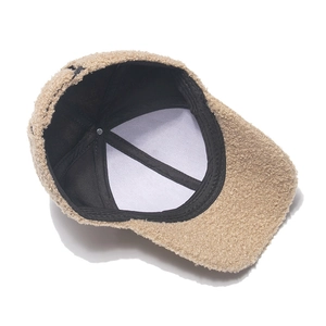 Detailed interior of khaki fleece baseball cap showing warm lining and stitching