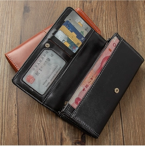 Detail view of leather long wallet interiors with multiple card slots and cash compartments