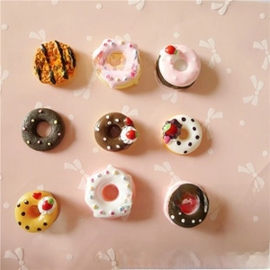Set of nine miniature resin donuts with detailed colorful frosting for DIY crafts