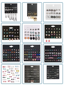 Detail view of colorful earring sets featuring animal, rainbow, and geometric stud designs