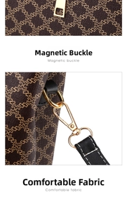 Detail of premium golden hardware zipper and clip on a brown geometric pattern handbag