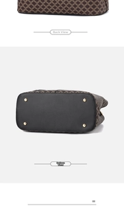 Detail of vintage monogram handbag showing the back view and bottom with gold metal studs