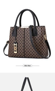 Side view of retro monogram tote bag with leather handles and gold metal hardware