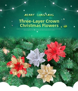 Close-up of triple-layered glitter Christmas flowers on green pine needles decoration