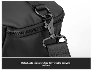 Detail of the detachable metal hook and woven strap on a black waterproof business backpack