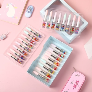 Lipstick shaped ballpoint pens with liquid glitter and pearls in a pastel unicorn theme