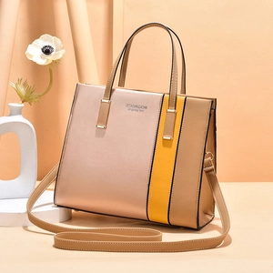 Elegant rose gold and yellow contrast tote bag with top handle and shoulder strap