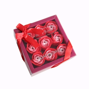 Elegant gift box featuring nine red and pink soap roses with a red ribbon bow
