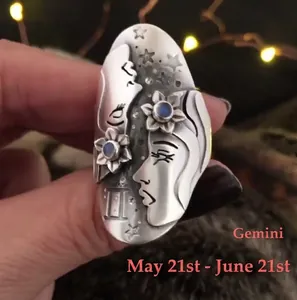 Vintage silver Gemini zodiac ring with floral carvings and blue gemstones for women
