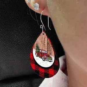 Christmas teardrop leather earrings featuring a red vintage truck and plaid design