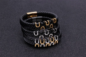 Braided black leather bracelets with gold, silver, and black metal U-shaped magnetic clasps
