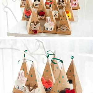 Triangle kraft gift box featuring plush animal characters and festive green pine motifs