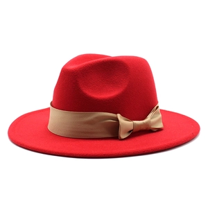 Classic red wool fedora hat with wide flat brim and champagne silk ribbon bow tie