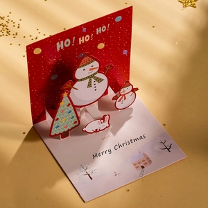 Carte de Noël 3D avec bonhomme de neige et renne, texte HO HO HO en feuille d'or