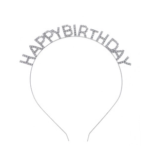Detail of silver birthday headband with sparkling rhinestones spelling Happy Birthday