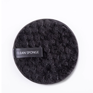 Close-up of black microfiber makeup remover sponge with a Clean Sponge logo tag