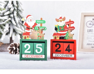 Detail showing red and green wooden Christmas countdown calendars with Santa and reindeer
